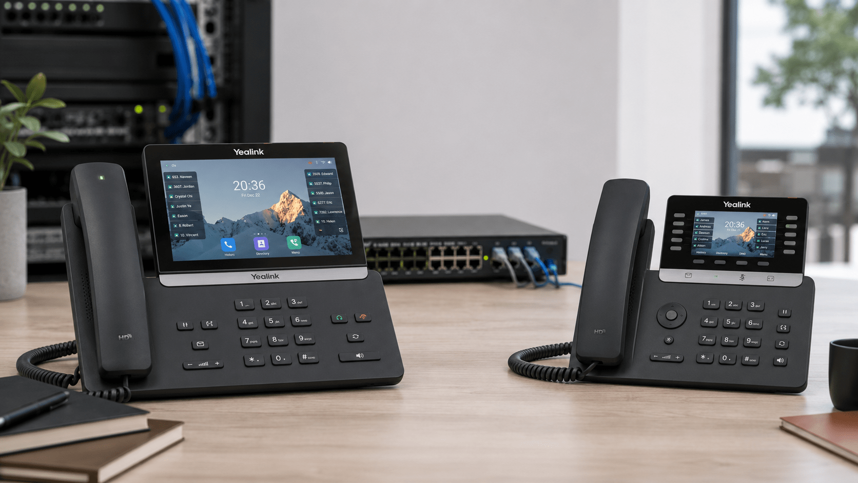 Yealink T85W vs T74U business IP phones compared on an office desk with PoE networking equipment.